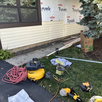 Titan Construction Enterprise - Vinyl siding being added to the house - Roofing Near Me - Plainfield, Illinois