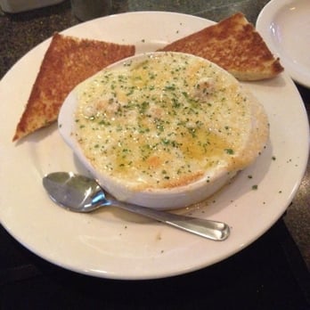 Charleston's - This is "Shrimp Cargot" Rich, creamy, very well done. A must have - American Near Me - Edmond, Oklahoma