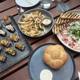 Sushi combo, truffle fries, beef carpaccio, bread