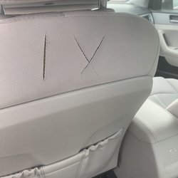 Hertz Rent A Car - I don't know what this means but I know that Hertz isn't making sure to offer a quality experience. Those are seat tears.