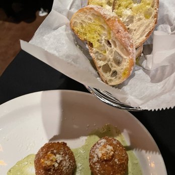 Sugo Restaurant - Arancini with a delicious creamy, tangy sauce and the complimentary bread basket with olive oil and Parmesan. - Italian Near Me - Johns Creek, Georgia Sugo Restaurant - Arancini with a delicious creamy, tangy sauce and the complimentary bread basket with olive oil and Parmesan. - Italian Near Me - Johns Creek, Georgia