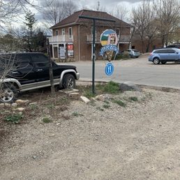 a pickup truck parked at a stop sign
