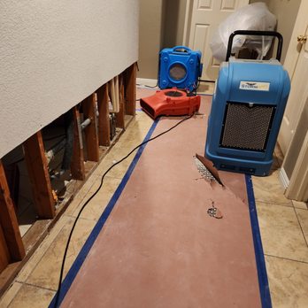 Integrity Restoration Pros - Here you can see how he protected my rug. That is taped down. And I did not want to remove or the tape wouldn't stick again. - Damage Restoration Near Me