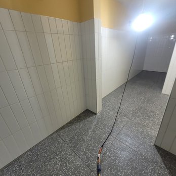 Precision Floor Covering - a bathroom with a hose attached to the floor - Flooring Near Me - Irvine, California Precision Floor Covering - a bathroom with a hose attached to the floor - Flooring Near Me - Irvine, California