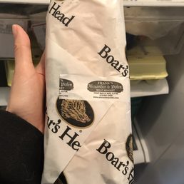 a person holding a bag of food