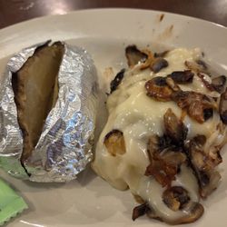 Smothered grilled chicken breast melted swiss cheese grilled onions & mushrooms. Baked potato with butter and sour cream