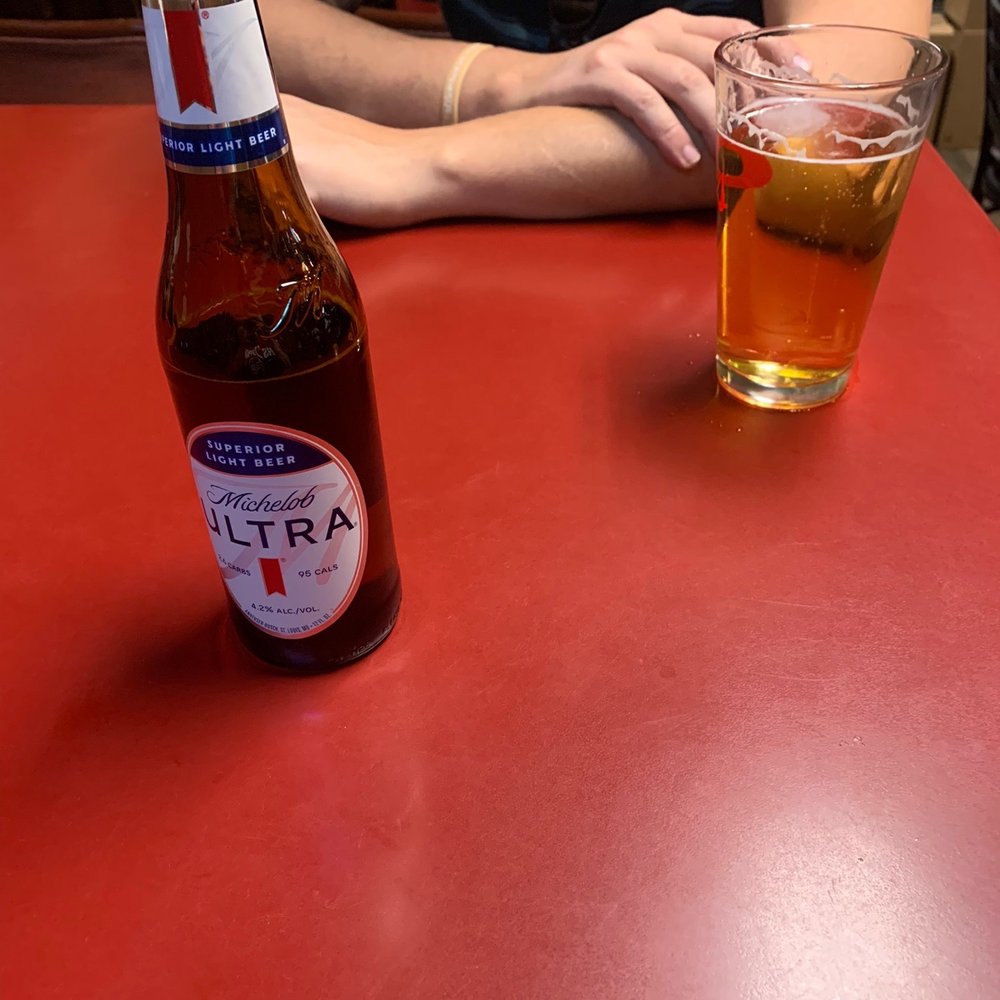 The GR - a person sitting at a table with a beer - Burgers Near Me - Twin Falls, Idaho The GR - a person sitting at a table with a beer - Burgers Near Me - Twin Falls, Idaho