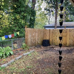 D & C Movers - The fenced corner had been filled with a rotted wooden base for an 8 x 10 shed, leftover building materials, and uprooted bushes.