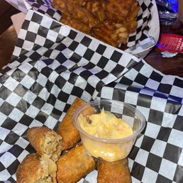 Boudin egg rolls & waffle fries. Boudin egg rolls & waffle fries.
