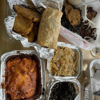 Rasin Haitian - Griot pork platter, djon djon side, green plantains, Haitian mac, cabbage, chicken & codfish patties - Haitian Near Me - Charlotte, North Carolina Rasin Haitian - Griot pork platter, djon djon side, green plantains, Haitian mac, cabbage, chicken & codfish patties - Haitian Near Me - Charlotte, North Carolina