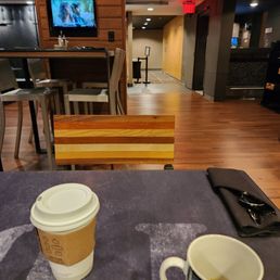 a cup of coffee on a table a cup of coffee on a table