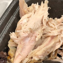 a close up of a chicken and beans dish