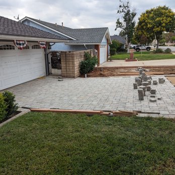 Smith Landscape - a brick patio being installed in front of a house - Masonry/Concrete Near Me - Upland, California