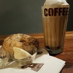 Coffee Fellows - Everything bagel toasted with a panini press with a side of cream cheese plus a glass of Black/White Macchiato
