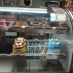 a display case filled with cakes