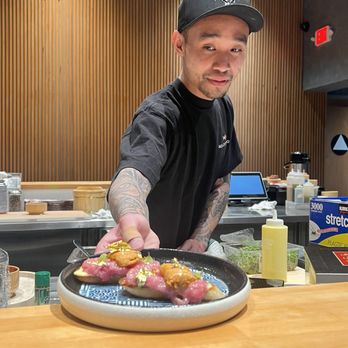 Hello Temaki - Chef Tien serving uni toast. - Sushi Bars Near Me - Elk Grove, California
