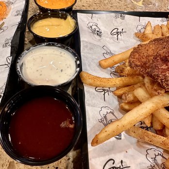 Guy Fieri's Kitchen+Bar Express - The chicken tenders comes with ALL these sauces = LOVE! - New American Near Me - Burbank, California Guy Fieri's Kitchen+Bar Express - The chicken tenders comes with ALL these sauces = LOVE! - New American Near Me - Burbank, California