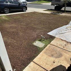 Island Topsoil Service - You can see the heavy mulch on one end closest to fence.