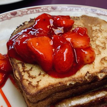 Andy's Cafe - a stack of french toast with strawberries on top - Cafes Near Me - Des Plaines, Illinois