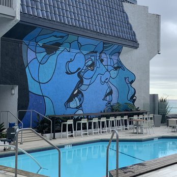 The Wayfarer San Diego - Pool and mural area with bar seating . The pool is heated. Not pictured is also the jacuzzi - San Diego, CA