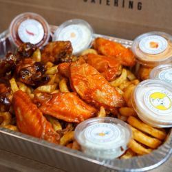 This is Chef on Call's Shaker Fries & Chicken Wings in a catering box