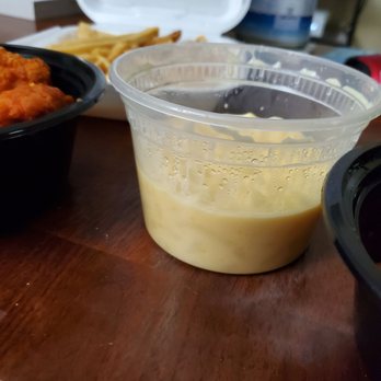 Kings Of Wings - a bowl of sauce next to a container of fries - Chicken Wings Near Me - Kent, Washington Kings Of Wings - a bowl of sauce next to a container of fries - Chicken Wings Near Me - Kent, Washington