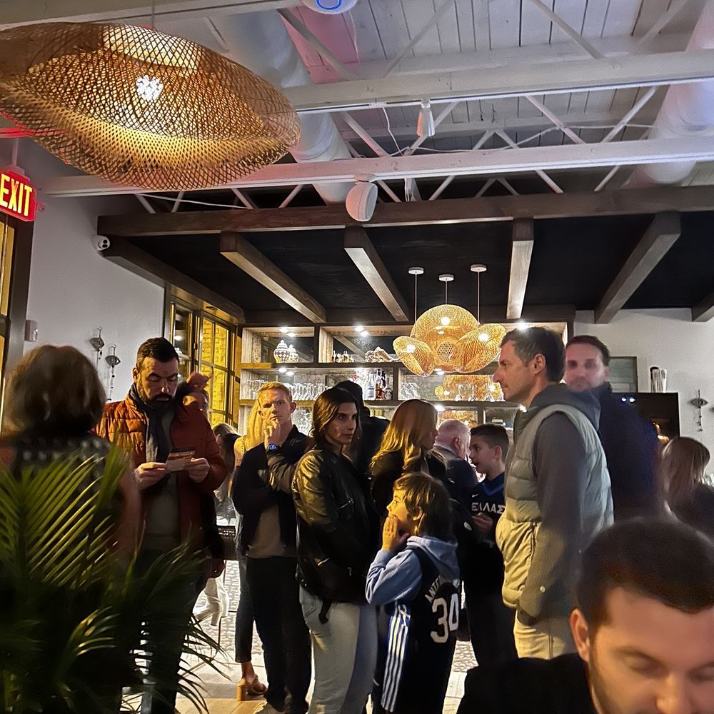 Avli - Tons of folks waiting to be seated, bled into around the dining tables - Greek Near Me - Milwaukee, Wisconsin Avli - Tons of folks waiting to be seated, bled into around the dining tables - Greek Near Me - Milwaukee, Wisconsin