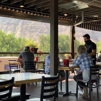 Zax Restaurant - people sitting at tables in a restaurant - Pizza Near Me - Moab, Utah Zax Restaurant - people sitting at tables in a restaurant - Pizza Near Me - Moab, Utah