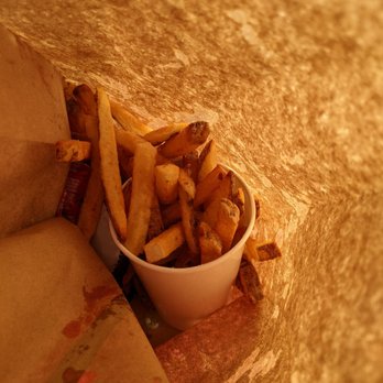 Five Guys - a bowl of french fries on a table - Burgers Near Me - Columbus, Ohio