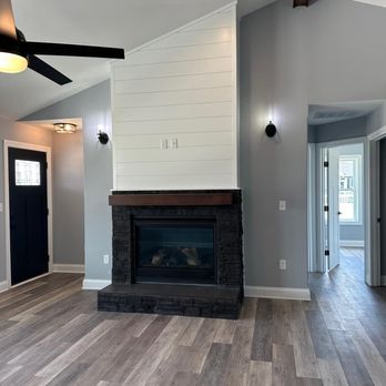 Tyme Builder - a living room with a fireplace - General Contractors Near Me - Seaford, Delaware