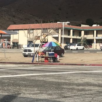 Tamales Deliciosos - a person sitting under an umbrella - Food Stands Near Me - Acton, California Tamales Deliciosos - a person sitting under an umbrella - Food Stands Near Me - Acton, California
