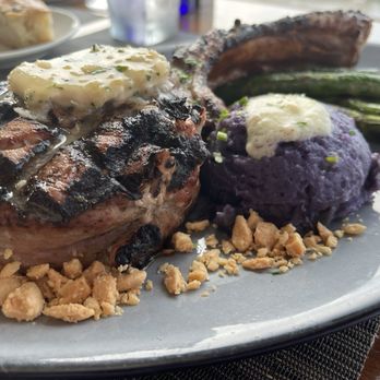 Altius - Tomahawk Pork Chop with asparagus and purple potato's - New American Near Me - Pittsburgh, Pennsylvania
