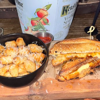 Chops + Hops Axe Throwing Lodge - Grilled Cheese with Fig Jelly and Tater Tots - Axe Throwing Near Me - Fort Lauderdale, Florida Chops + Hops Axe Throwing Lodge - Grilled Cheese with Fig Jelly and Tater Tots - Axe Throwing Near Me - Fort Lauderdale, Florida