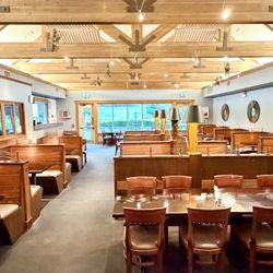 Dining room. There's a bar with televisions in the attached room to the left.