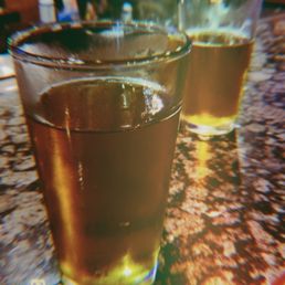 three glasses of beer on a table
