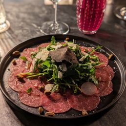 Beef carpaccio with truffle shaved at my table