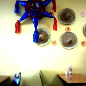 Panaderia Y Restaurant Sanchez - a panadera and hats on the wall - Mexican Near Me - Aurora, Colorado Panaderia Y Restaurant Sanchez - a panadera and hats on the wall - Mexican Near Me - Aurora, Colorado
