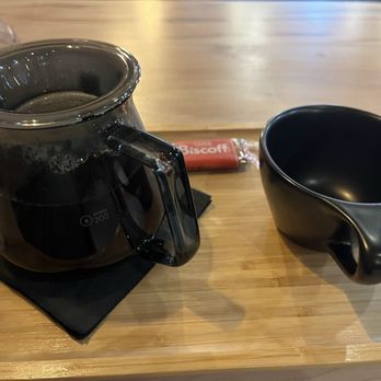 Tselia Coffee - Presentation -pour over coffee, whole lil pot and a discoff treat! - Coffee & Tea Near Me - Greenville, South Carolina Tselia Coffee - Presentation -pour over coffee, whole lil pot and a discoff treat! - Coffee & Tea Near Me - Greenville, South Carolina