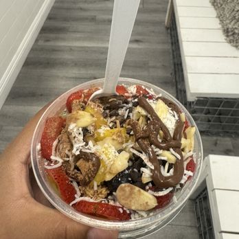 Flavor Theory - Acaí bowl: tropical and mange base with strawberries, blueberries, almonds coconut, Nutella drizzle, and cinnamon powder - Acai Bowls Near Me - Upland, California