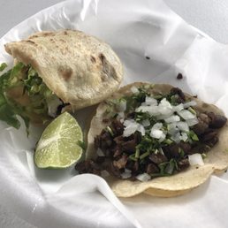 a taco with meat and onions a taco with meat and onions