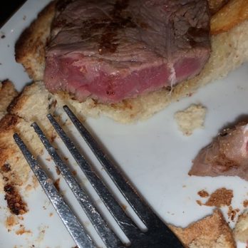 Harborside Grill - a piece of steak on a plate with bread and a fork - New American Near Me - Atlantic Highlands, New Jersey Harborside Grill - a piece of steak on a plate with bread and a fork - New American Near Me - Atlantic Highlands, New Jersey