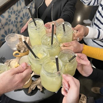 Makan - a group of people clinking glasses of lemonade - Lebanese Near Me - Montreal, Quebec