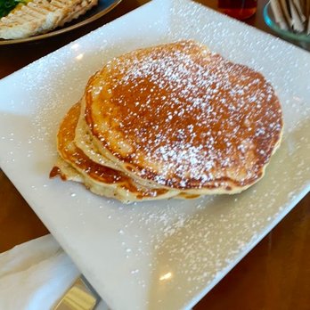 Aeirloom Bakery - Three enormous pancakes with powdered sugar and maple syrup - New American Near Me - Los Angeles, California