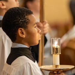 Saint Paul the Apostle School - Altar servers getting ready for all school mass.