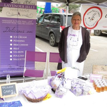 Wolf Ranch Farmer's Market - a woman standing in front of her booth - Farmers Market Near Me - Georgetown, Texas Wolf Ranch Farmer's Market - a woman standing in front of her booth - Farmers Market Near Me - Georgetown, Texas