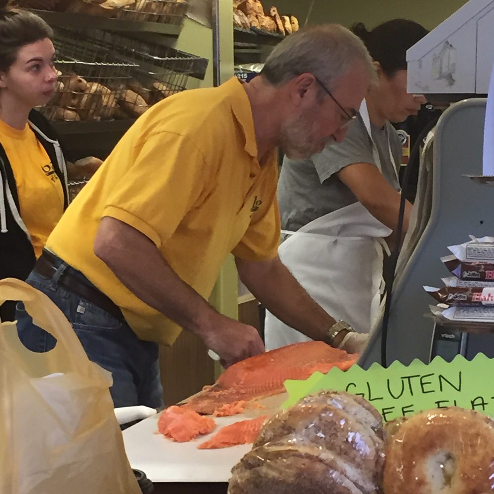 Bagel Plaza - This guy's been cutting the lox and sable for as long as I can remember. There is really an art to doing it just right. - Bagels Near Me - Merrick, New York Bagel Plaza - This guy's been cutting the lox and sable for as long as I can remember. There is really an art to doing it just right. - Bagels Near Me - Merrick, New York
