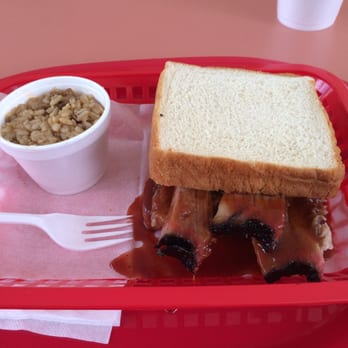 Nickel Sandwich Grill - Sliced brisket sandwich with dirty rice. - Barbeque Near Me - Houston, Texas Nickel Sandwich Grill - Sliced brisket sandwich with dirty rice. - Barbeque Near Me - Houston, Texas