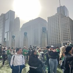 People watching the river turn green