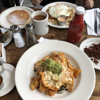 Breakfast House - Chilaquiles (chorizo, sour cream, red sauce on the side), supreme chorizo hash with side of pancake. - Breakfast & Brunch Near Me - Chicago, Illinois Breakfast House - Chilaquiles (chorizo, sour cream, red sauce on the side), supreme chorizo hash with side of pancake. - Breakfast & Brunch Near Me - Chicago, Illinois