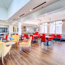 Arizona Residential & Commercial Photography - Lobby view showcasing the refreshed dining area with modern seating at Hilton Garden Inn.